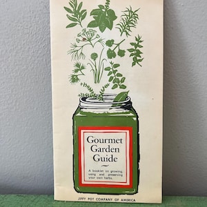 May include: A vintage booklet titled "Gourmet Garden Guide" with a green and red design. The cover features a green jar with herbs sprouting from it. The text reads "A booklet on growing, using and preserving your own herbs."