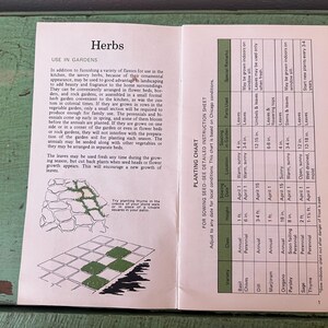 May include: Open book with the title "Herbs" and planting instructions. The left page has text about using herbs in gardens, with illustrations of a stone wall and a grid. The right page is a planting chart.