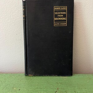 May include: A vintage hardcover book with a black cover. The title "Selections from Browning" is printed in gold lettering, along with "Academy Classics" and the publisher "Allyn and Bacon". The book is in good condition.