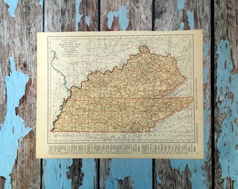 Könnte beinhalten: Eine Vintage-Straßenkarte von Kentucky und Tennessee, die die Grenzen der Countys und die wichtigsten Straßen zeigt. Die Karte ist auf cremefarbenem Papier mit braunen und roten Linien gedruckt. Der Titel "Rand McNally Road Map of Kentucky and Tennessee" ist oben auf der Karte gedruckt.