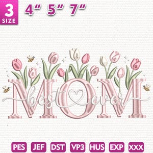 May include: Embroidered design in pink and white, featuring the word "MOM" and "best ever" in cursive, with a heart in the "O". The design includes pink and white tulips, green leaves, and bees. Sizes available: 7.6 cm, 10.2 cm, 12.7 cm, and 17.8 cm.