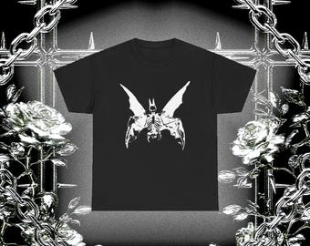 May include: Black t-shirt featuring a white graphic of a skeletal bat with outstretched wings. The shirt has a crew neck and short sleeves. The word "SAMORE" is printed at the bottom of the image.