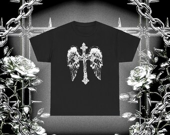 May include: Black t-shirt featuring a white graphic of a cross with angel wings. The design is centered on the shirt. The word "ISAMORE" is printed at the bottom of the image. The background includes chains, roses, and a cross.