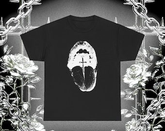 May include: Black t-shirt featuring a white graphic of an open mouth with a sword. The shirt has a crew neck and short sleeves. The word "SAMORE" is printed at the bottom of the shirt. The background has a gothic design with roses and chains.