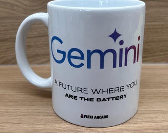 May include: A white ceramic mug featuring the word Gemini in a blue to purple gradient font with a star icon. Below, the text reads A FUTURE WHERE YOU ARE THE BATTERY in black, with the small logo and text FLEXI ARCADE at the bottom.