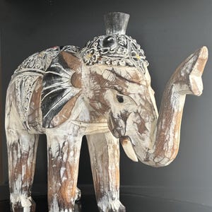 carved and painted wooden elephant