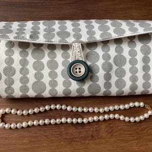Circular Gray Cotton Travel Jewelry Organizer: Geometric Print, Lace Ribbon