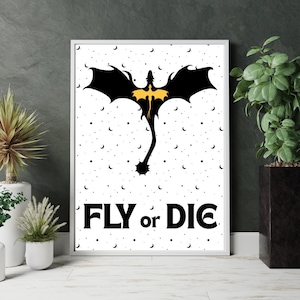 May include: Black and white poster with a silhouette of a dragon flying against a white background with black crescent moons. The dragon has a yellow body. The text "FLY or DIE" is printed in black at the bottom of the poster.