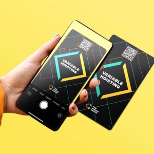 May include: Two black cards with a yellow and turquoise design. The cards have a QR code and the text "VARIABLE HOISTING" and "THE CODING CARDS".