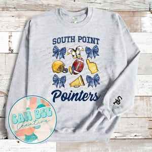 May include: Gray sweatshirt with the text "South Point Pointers" in blue and yellow. The design includes a football, cheerleaders, and a football helmet.