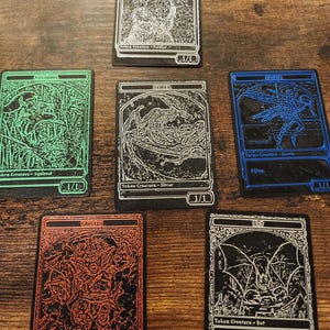 May include: Six trading cards with detailed illustrations and text. The cards feature various creatures, including a soldier, squirrel, faerie, goblin, bat, and a silver creature. Each card has a unique color border and design.