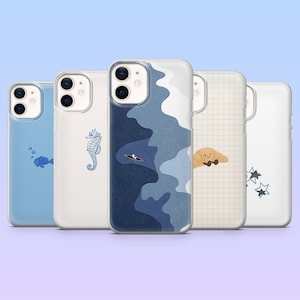 May include: Five phone cases with different designs. One is light blue with a fish illustration, another has a seahorse, and a third features a boat on blue waves. The fourth case has a croissant, and the last has stars.
