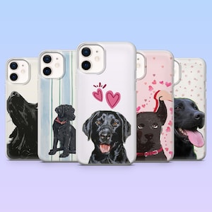 May include: A collection of five phone cases featuring illustrations of black Labrador Retrievers. The cases showcase various designs, including a dog howling, a dog with a red collar, and a dog with hearts. The cases are white and have a glossy finish.