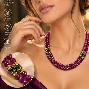 May include: A double-strand necklace featuring faceted deep red ruby beads interspersed with gold-toned spacers and central green gemstone accents. The jewelry is presented with text overlays including Natural Ruby Jewelry and Natural Elegance.
