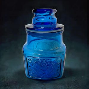 Recipiente de vidrio repujado WHEATON con junta de plástico suave dentro de la tapa.