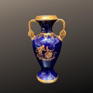 Limoges Cobalt blue and gold gilded vase with romantic scene. Height 5.5”