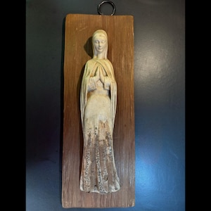 Madonna Wall Plaque mounted on wood.