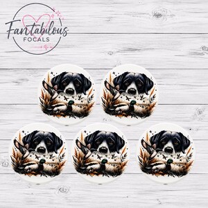 May include: Five white ceramic coasters with a hunting dog design. The design features a black and white dog, ducks, and foliage in shades of brown and green. The coasters are arranged on a white wood-grain surface. The top left corner has the text "Fantabulous Focals".