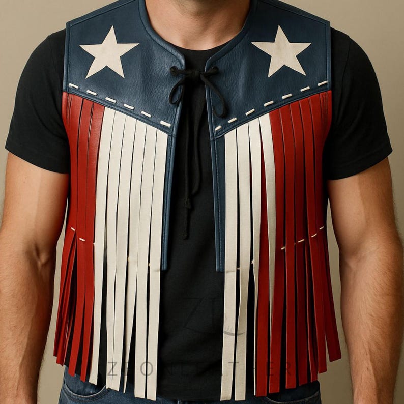 May include: A leather vest with a patriotic design. The vest features a blue top with white stars, red and white fringe, and a black tie closure. The vest is sleeveless.