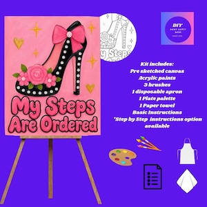 May include: A DIY paint party kit featuring a pre-sketched canvas on an easel with a high-heeled shoe illustration, pink background, and the text My Steps Are Ordered. Includes acrylic paints, three brushes, an apron, palette, and instructions.