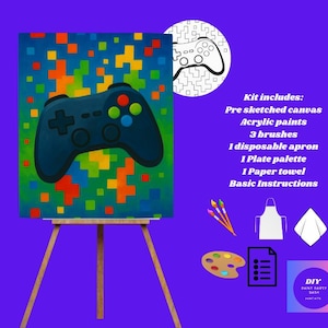 May include: A paint-by-numbers kit featuring a pre-sketched canvas with a video game controller design. The kit includes acrylic paints, brushes, a palette, apron, and instructions. The canvas is displayed on a wooden easel.