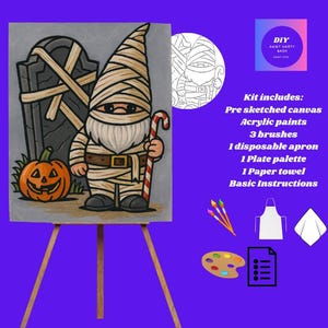 Könnte beinhalten: Ein DIY-Malset zum Thema Halloween. Die vorgemalte Leinwand zeigt einen Mumien-Zwerg mit Zuckerstange, Kürbis und Grabstein. Das Set enthält Acrylfarben, Pinsel, eine Schürze, eine Palette, ein Papiertuch und Anweisungen. Text: DIY Paint Party Bash.