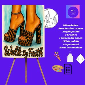 May include: A DIY paint kit featuring a pre-sketched canvas of high-heeled platform sandals with a leopard print design. The canvas is on an easel, with the words "Walk by Faith" below the image. The kit includes acrylic paints, brushes, and other supplies.