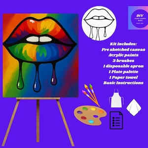 May include: A DIY paint kit featuring a rainbow-colored lips painting on a canvas, displayed on a wooden easel. The kit includes acrylic paints, brushes, an apron, a palette, a paper towel, and instructions. The image has the text "DIY PAINT PARTY BASH".