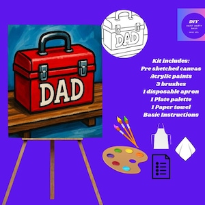 Pode incluir: Uma caixa de ferramentas vermelha com a palavra "DAD" em letras brancas, colocada sobre uma superfície de madeira, é o ponto focal deste kit de pintura DIY. O kit inclui uma tela pré-desenhada, tintas acrílicas, pincéis, um avental, uma paleta, uma toalha de papel e instruções.