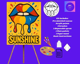 Könnte beinhalten: Ein DIY-Malset mit einer gelben Leinwand mit einem bunten Lippen-Design und dem Wort "SUNSHINE". Das Set enthält Acrylfarben, Pinsel, eine Palette, eine Schürze, ein Papiertuch und Anweisungen. Auf lila Hintergrund.