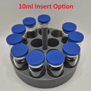 May include: A gray circular holder with ten clear glass vials, each sealed with a blue cap. The text "10ml Insert Option" is displayed in red at the top. The vials are arranged around a central gray post.