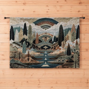 May include: A rectangular wall tapestry featuring a textured landscape scene with rolling hills, tall evergreen trees, and a central river flowing toward a layered mountain range under a large, multi-colored arched rainbow in a cloudy sky.