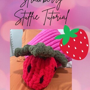 May include: A crocheted strawberry plush toy with a green crocheted leaf. The toy is pink and red and has a black seed design. The image includes the text "Strawberry Stuffe Tutorial".