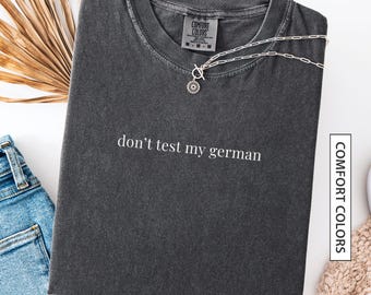 Camiseta alemana divertida, regalo para amigo bilingüe alemán. Camiseta con cita alemana divertida: "No pongas a prueba mi alemán". Camiseta de colores cómodos.