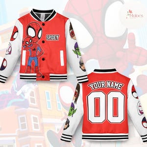 May include: Red and white Spidey varsity jacket. The front features a large Spiderman graphic and the word "Spidey". The sleeves have Spiderman face graphics. The back has the text "YOUR NAME" and the number "00".