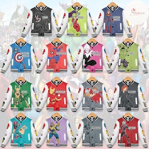 May include: Collection of colorful varsity jackets featuring various Marvel characters, including Venom, Spider-Man, and Captain America. Each jacket has white sleeves with character-themed accents and a contrasting body color. The jackets are displayed on wooden hangers.