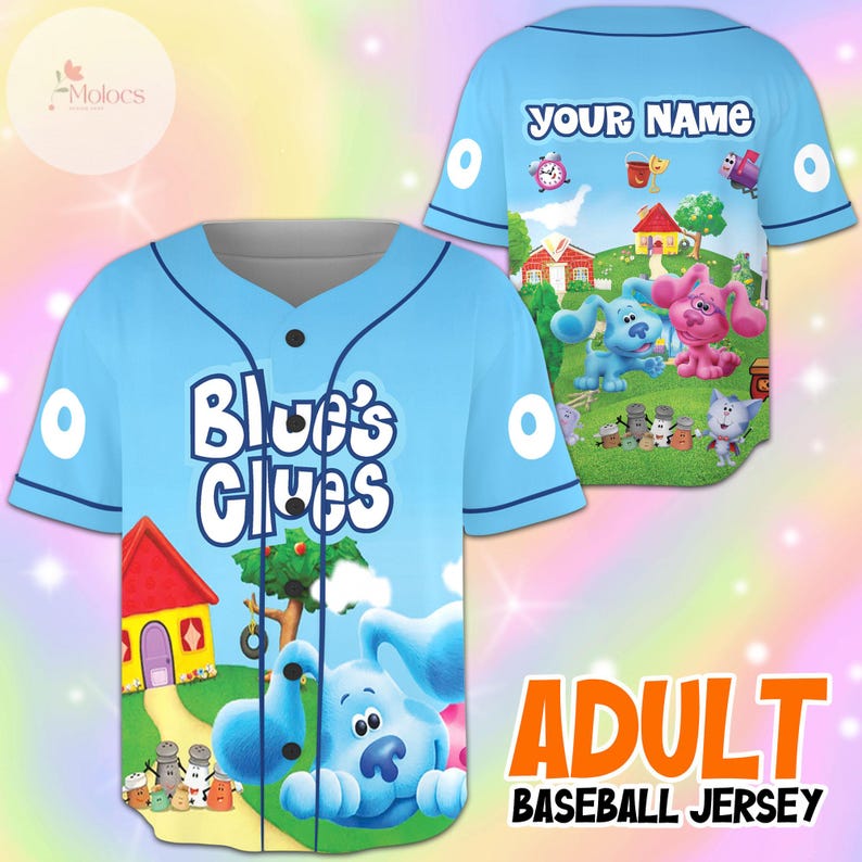 May include: Light blue adult baseball jersey featuring the text "Blue's Clues" on the front. The jersey has a cartoon graphic of Blue and other characters from the show. The back of the jersey has the text "YOUR NAME".