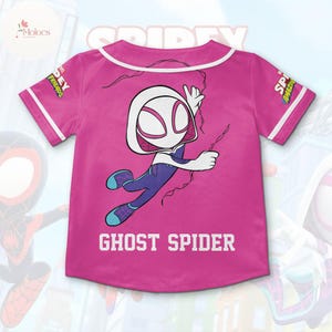 May include: Pink baseball jersey with a white Ghost Spider graphic and the text "Ghost Spider" on the front. The jersey has white piping around the collar and sleeves.