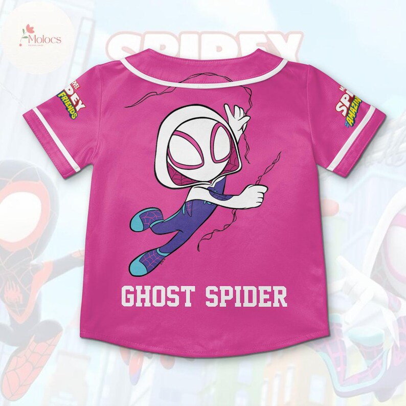 May include: Pink baseball jersey with a white Ghost Spider graphic and the text "Ghost Spider" on the front. The jersey has white piping around the collar and sleeves.