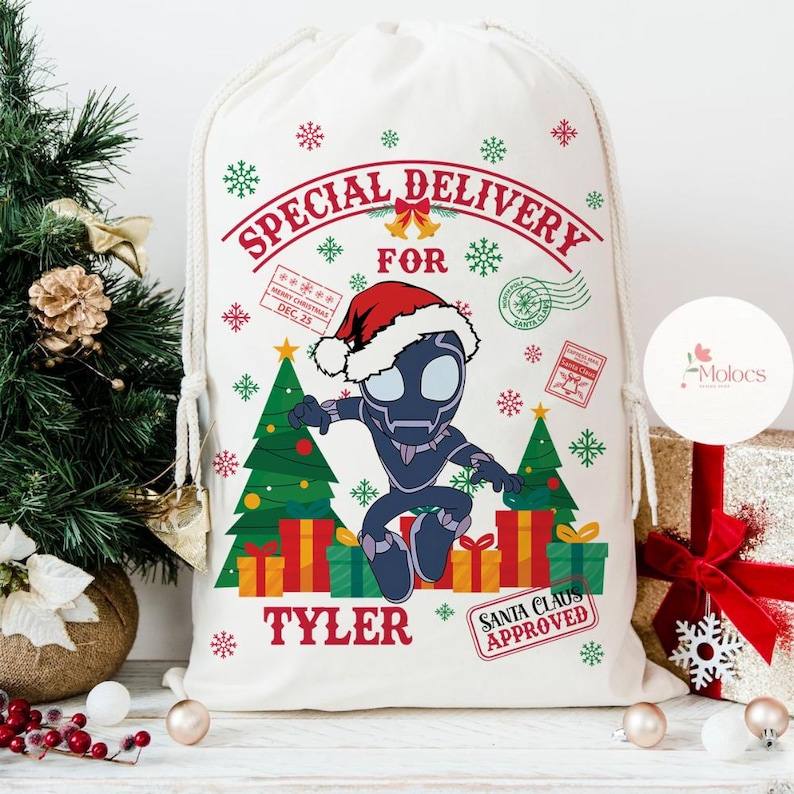 May include: A white drawstring Christmas gift bag with the text "SPECIAL DELIVERY FOR" and the name "TYLER". The bag features a cartoon character in a Santa hat, Christmas trees, gifts, and snowflakes.