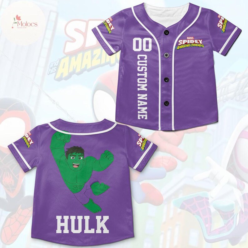 May include: Purple baseball jersey with a white trim and buttons. The front of the jersey has the text "SPIDEY AMAZING FRIENDS" and the number "00" with the text "CUSTOM NAME" below. The back of the jersey has a green cartoon image of the Hulk and the text "HULK" below.