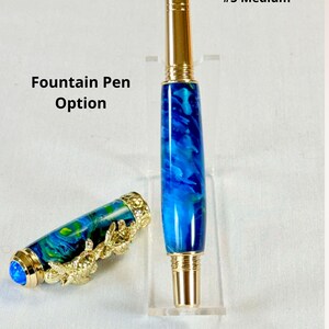 The Sea Turtle Roller Ball pen features a stunning blue-ocean synthetic Fire Opal, turtle shell texture, and sea turtle clip. Truly a turtle lover gift. It comes either as a Rollerball or Fountain Pen. The cap posts securely with wide threads that won't cross. Hawaiian Honu Pen that has beautiful ocean themed features. One of my favorite Sea Creatures is the Sea Turtle. This Pen has it all. The pen comes with a windowed pen box making this item gift-ready.