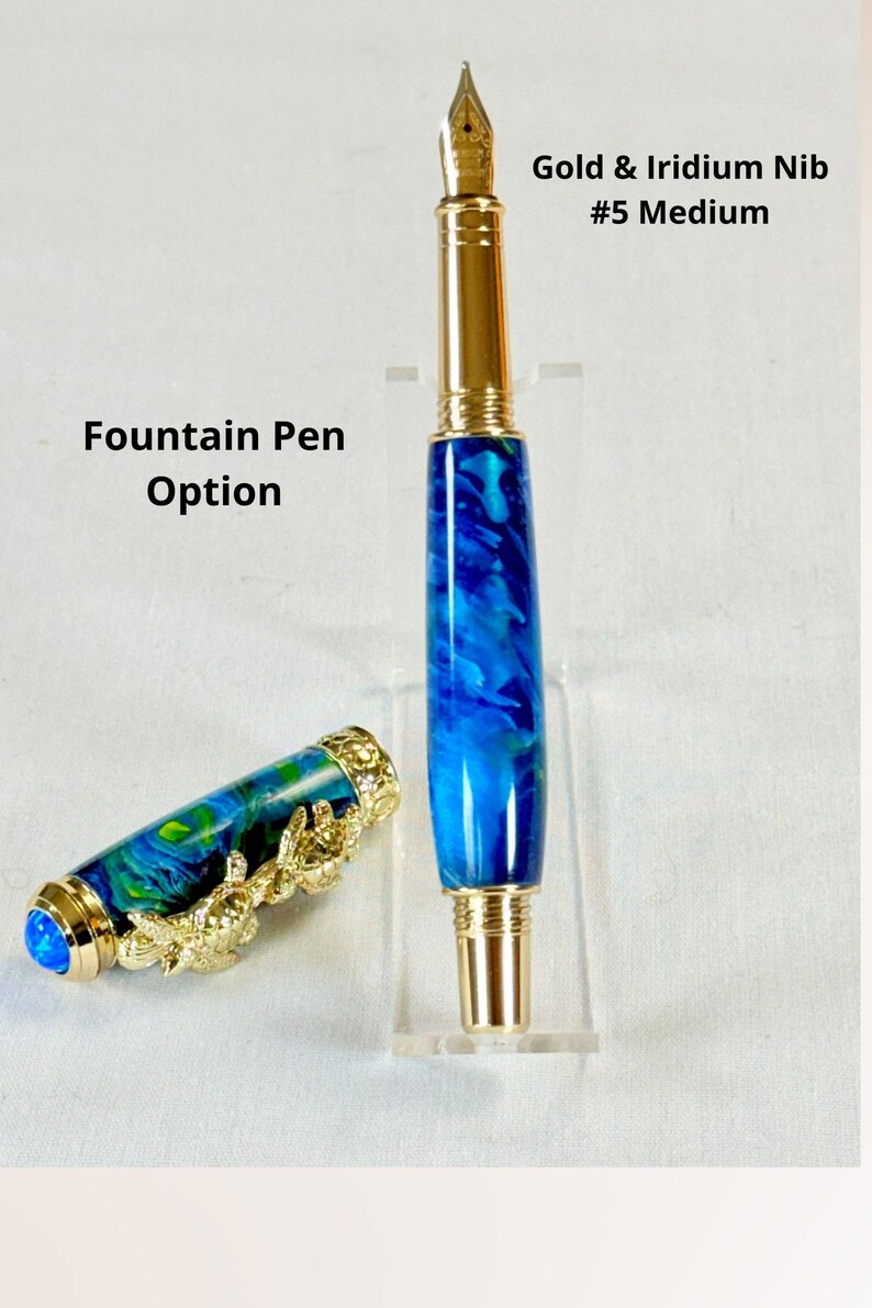 The Sea Turtle Roller Ball pen features a stunning blue-ocean synthetic Fire Opal, turtle shell texture, and sea turtle clip. Truly a turtle lover gift. It comes either as a Rollerball or Fountain Pen. The cap posts securely with wide threads that won't cross. Hawaiian Honu Pen that has beautiful ocean themed features. One of my favorite Sea Creatures is the Sea Turtle. This Pen has it all. The pen comes with a windowed pen box making this item gift-ready.