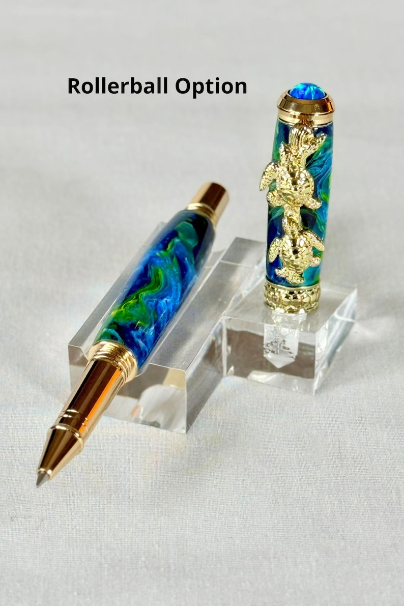 The Sea Turtle Roller Ball pen features a stunning blue-ocean synthetic Fire Opal, turtle shell texture, and sea turtle clip. Truly a turtle lover gift. It comes either as a Rollerball or Fountain Pen. The cap posts securely with wide threads that won't cross. Hawaiian Honu Pen that has beautiful ocean themed features. One of my favorite Sea Creatures is the Sea Turtle. This Pen has it all. The pen comes with a windowed pen box making this item gift-ready.