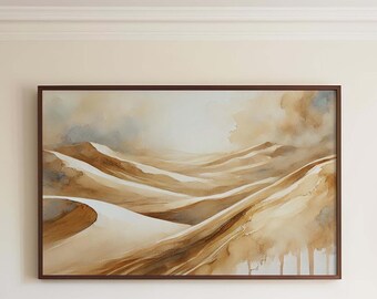 May include: A framed watercolor painting depicting a desert landscape with rolling sand dunes in shades of brown, beige, and white. The painting has a soft, ethereal quality, with hints of blue and gray in the sky.