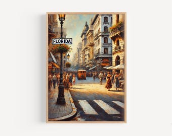 May include: A framed watercolor painting of a European street scene with a vintage trolley and pedestrians. The sign reads "FLORIDA". The buildings are beige and the sky is blue.