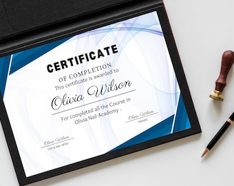 May include: A certificate of completion in a black frame with blue and white accents. The certificate is awarded to Olivia Wilson. A wooden stamp and a black pen with gold trim are next to the certificate.