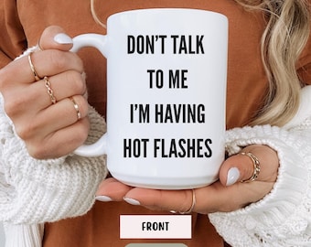 May include: White ceramic mug with the text "DON'T TALK TO ME I'M HAVING HOT FLASHES" in black. The mug is 425g and has a white handle. The word "FRONT" is printed on a rectangular label below the mug.