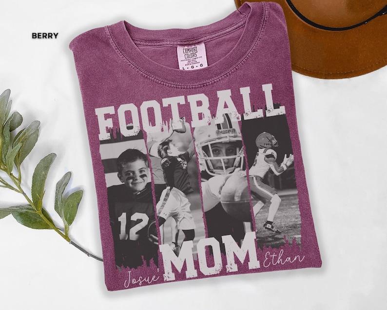 May include: Berry-colored t-shirt with the words "FOOTBALL MOM" in white block letters. The shirt features black and white photos of football players. The name "Ethan" is written in script below the words "FOOTBALL MOM". The word "Berry" is in the upper left corner.