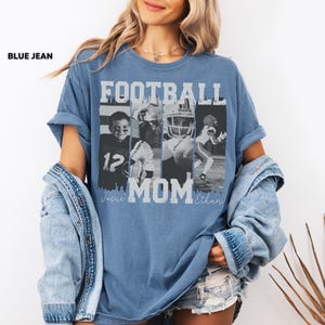 May include: Blue jean-colored t-shirt with the words "FOOTBALL MOM" in white block letters. The shirt features a collage of four black and white images of football players. The names "Jesie" and "Ethan" are printed below the word "MOM".